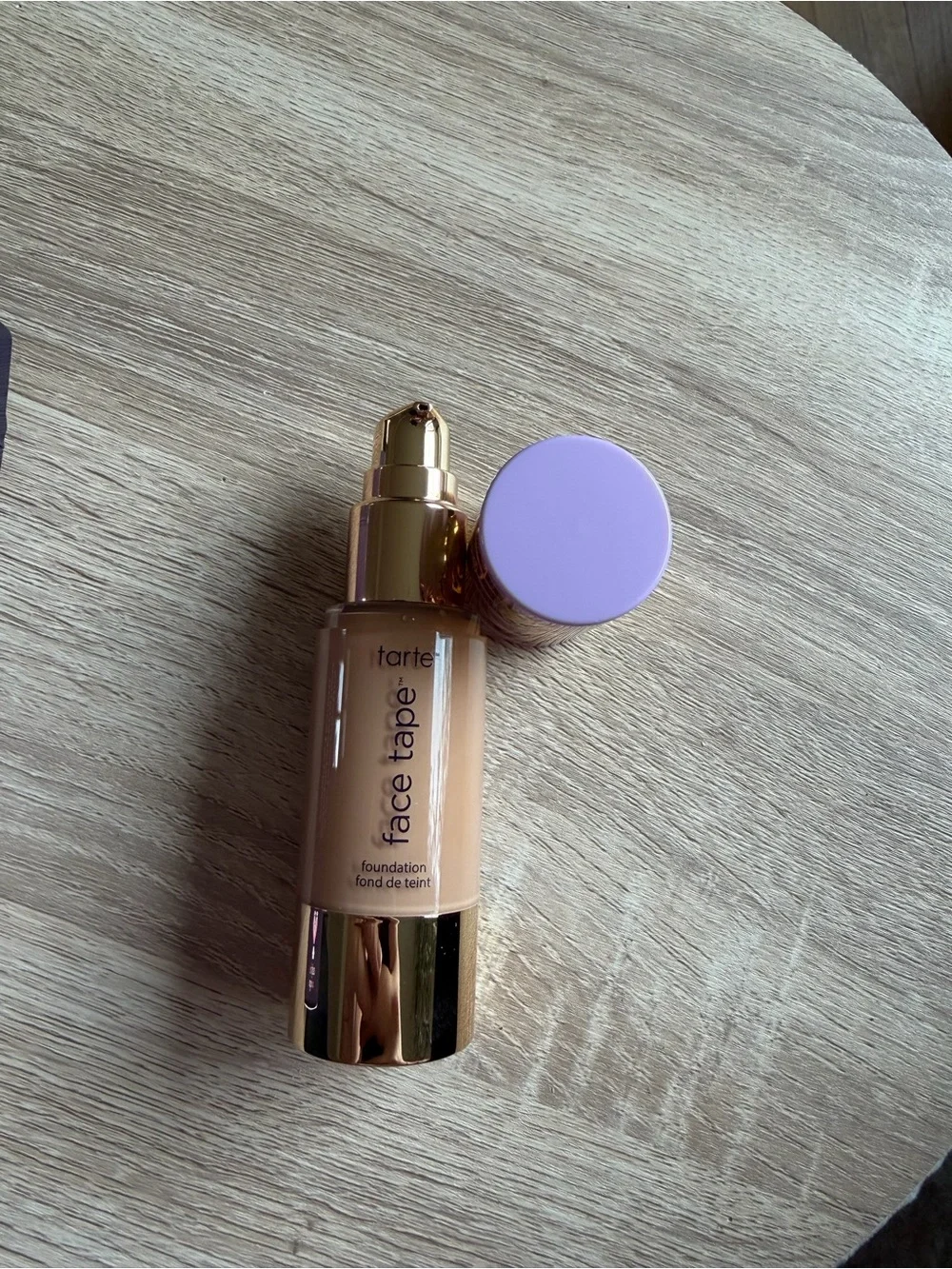 tarte Face Tape Foundation — beige with purple and gold cap accents